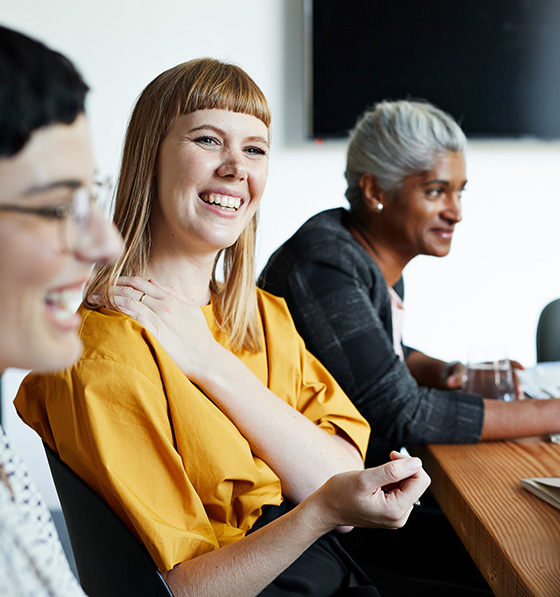 Smiling woman at a meeting