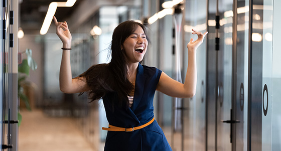 Young woman dancing in the office