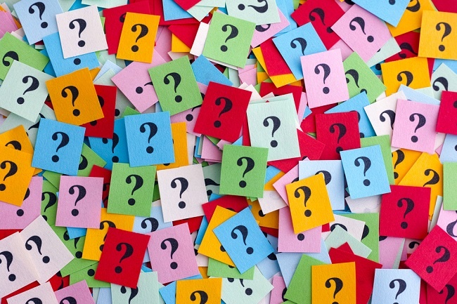 Multiple colored sticky notes with a question mark on each
