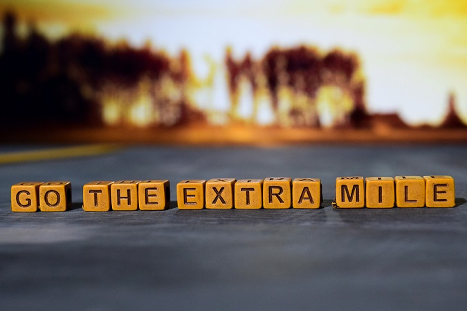 Cubed letters that say: "Go the extra mile"