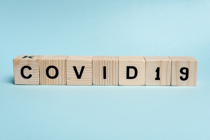 Cubes that say, "Covid 19"